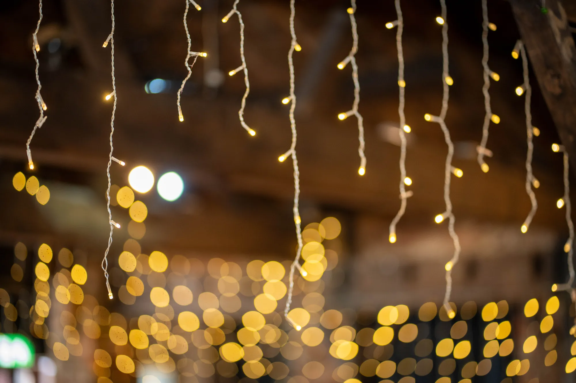 Strings of fairy lights hanging from the beams of the function room
